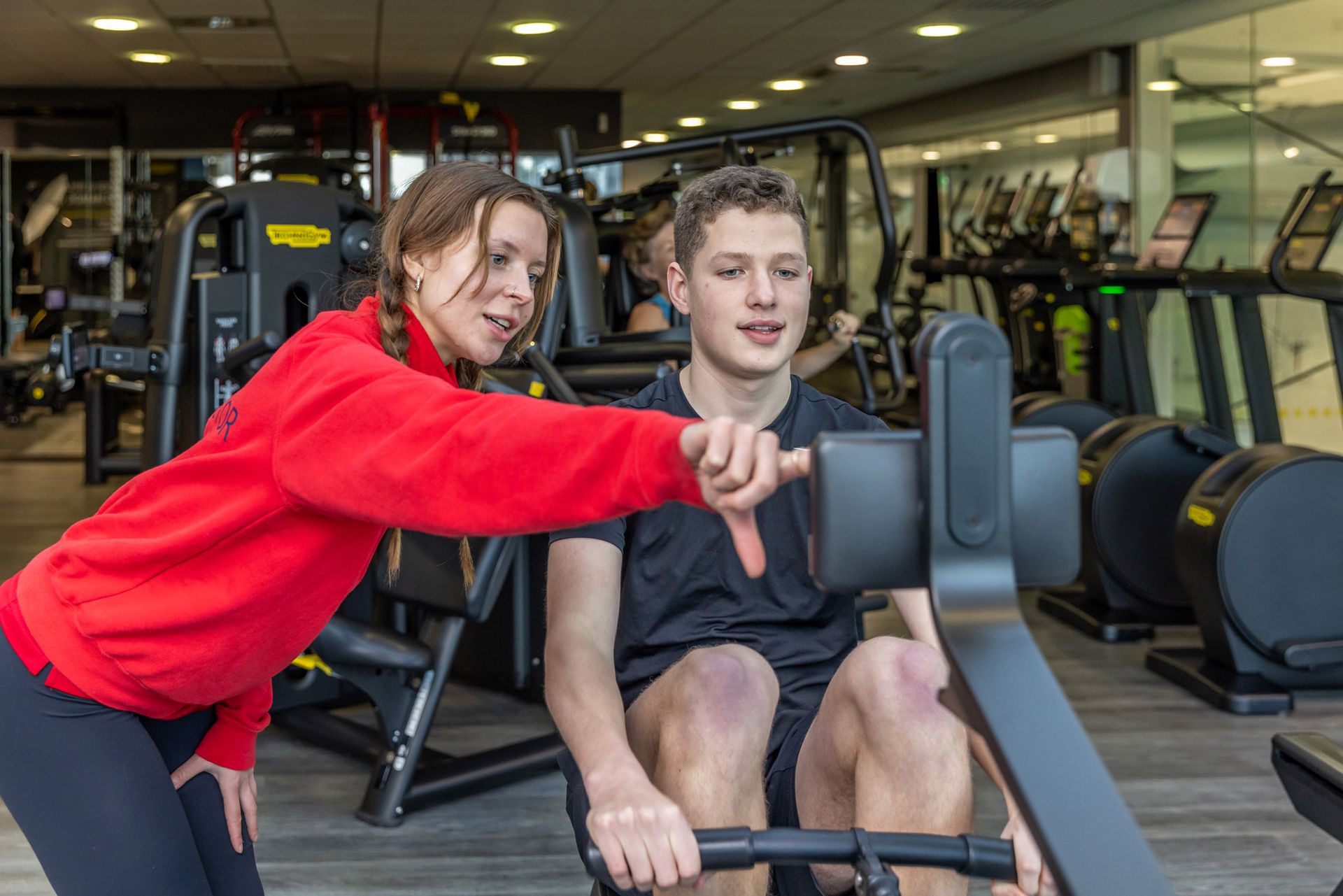 Female instructor with male member in the gym during their 12 week wellbeing jounrey at Westwoods health Club