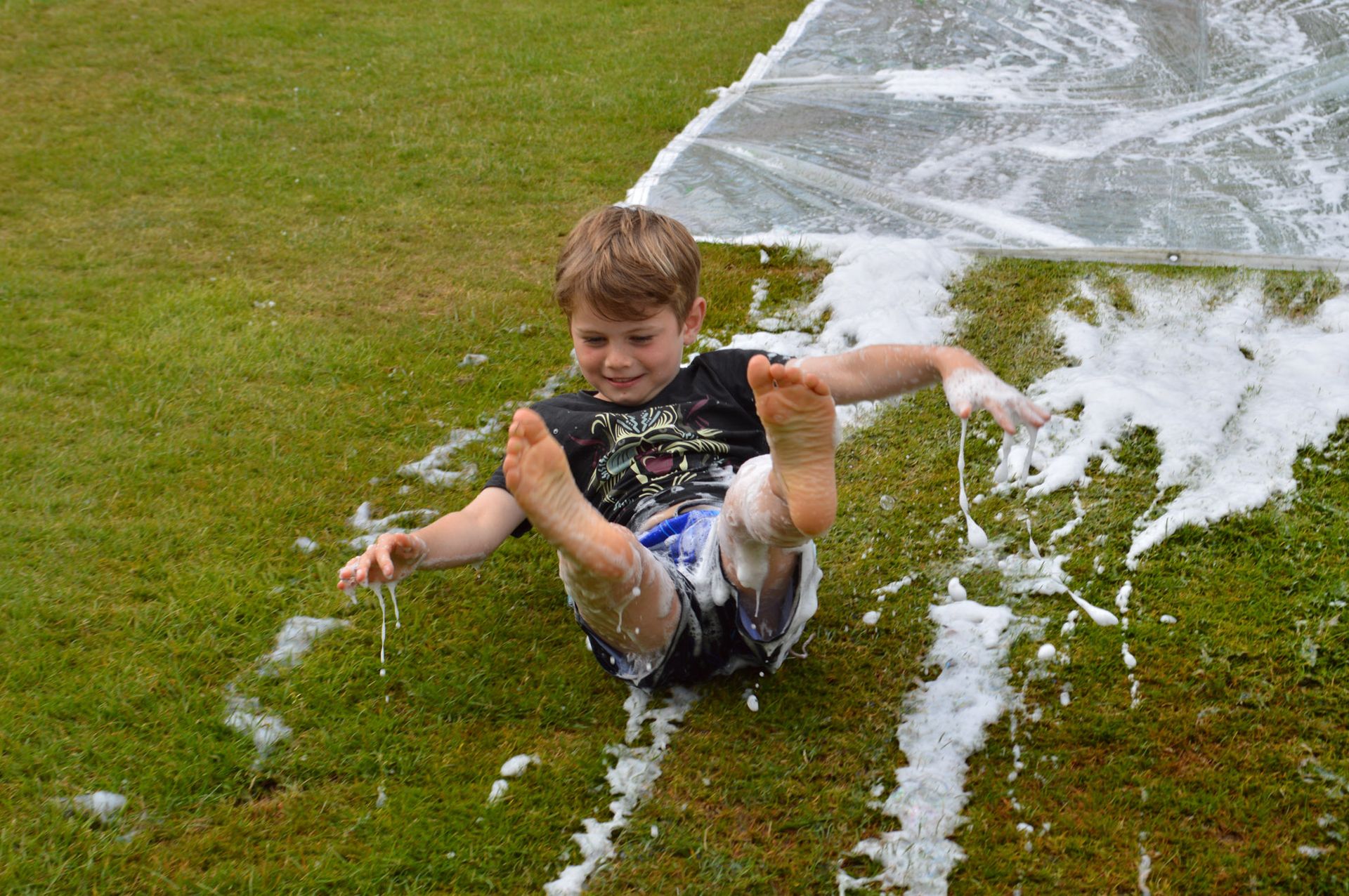 Slip and slide during the Fettes Active multi-activity camp at westwoods health club and fettes college