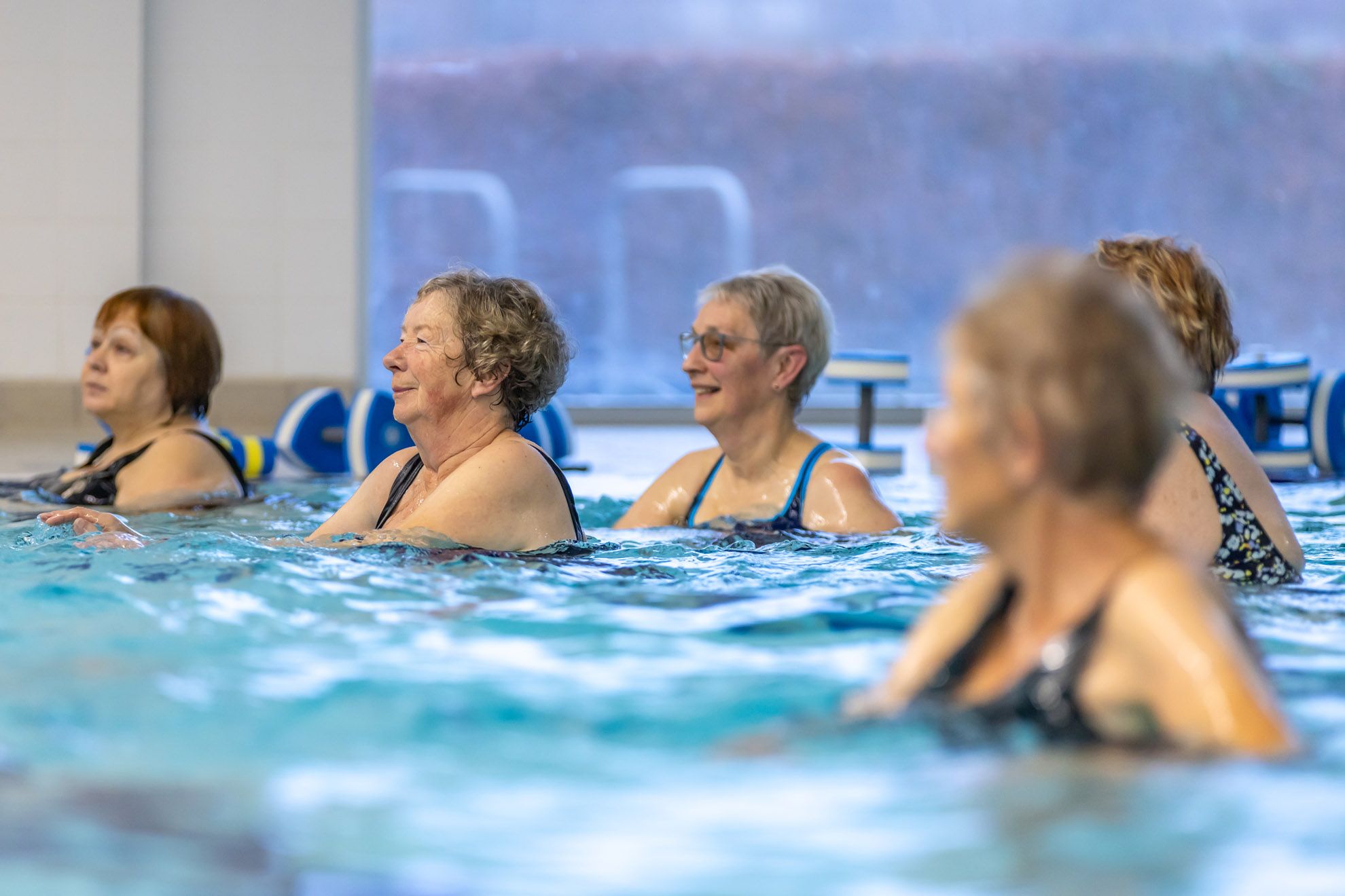 Aqufit class taking place in the 25 meter 6 lane pool at Westwoods Health Club