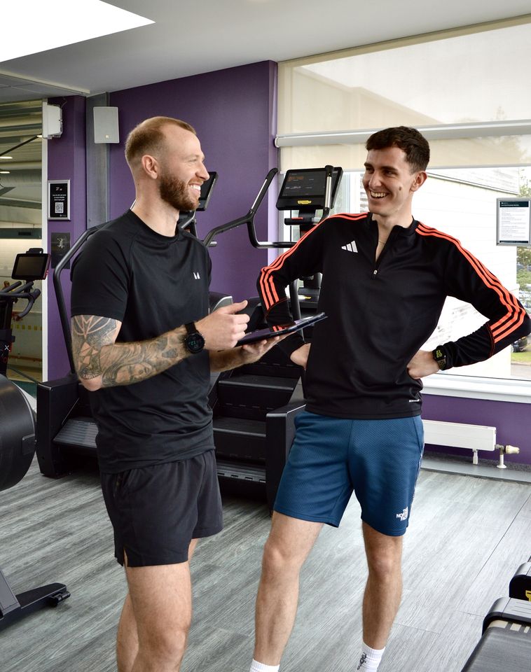 Matt Lawson with personal training client in gym.